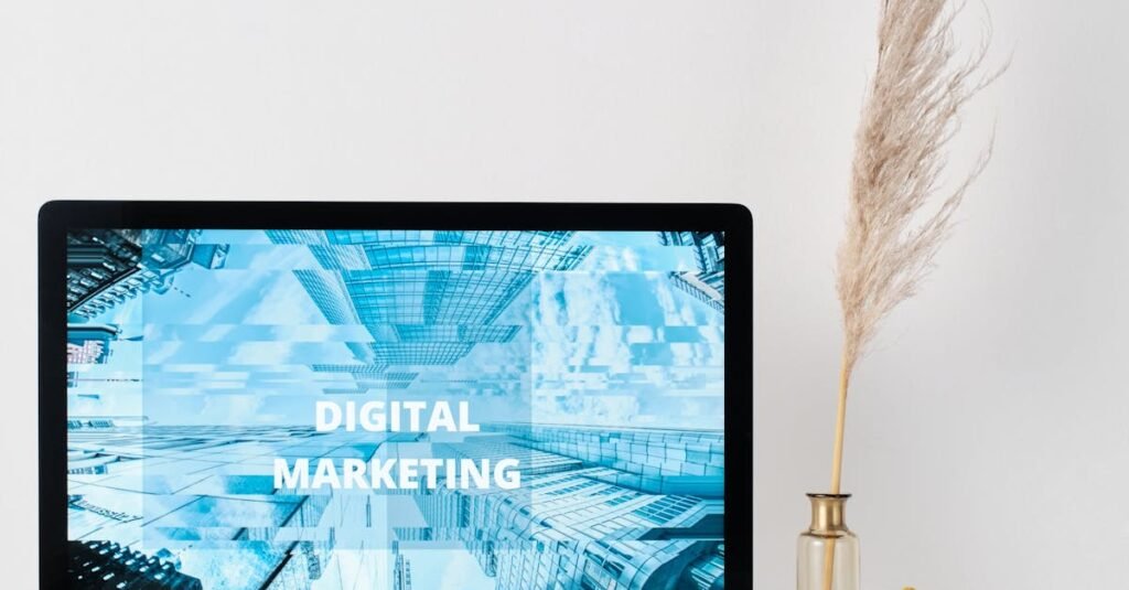 Modern workspace featuring a monitor displaying digital marketing graphics on a minimalist desk.
